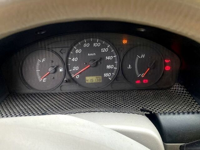 Серый Мазда Демио, объемом двигателя 1.3 л и пробегом 444 тыс. км за 1400 $, фото 5 на Automoto.ua