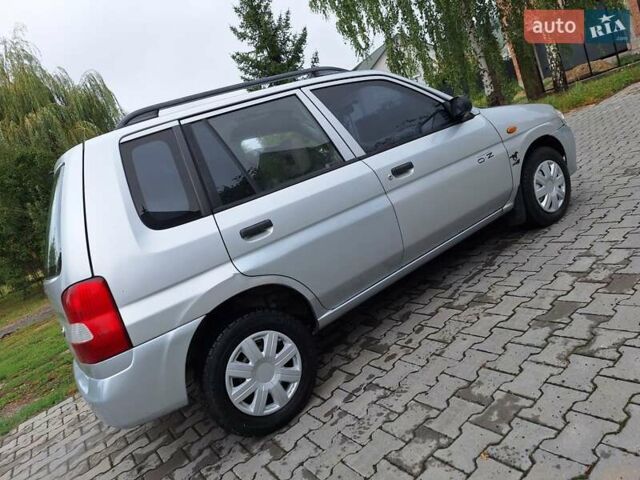 Серый Мазда Демио, объемом двигателя 1.3 л и пробегом 217 тыс. км за 1350 $, фото 11 на Automoto.ua