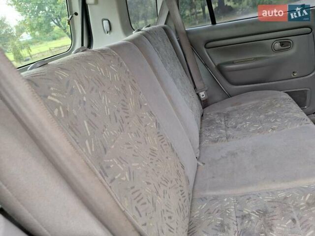 Серый Мазда Демио, объемом двигателя 1.3 л и пробегом 217 тыс. км за 1350 $, фото 21 на Automoto.ua
