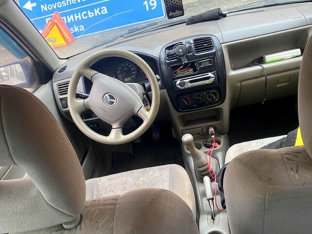 Сірий Мазда Деміо, об'ємом двигуна 1.3 л та пробігом 444 тис. км за 1400 $, фото 6 на Automoto.ua