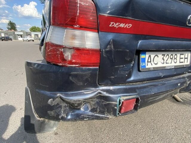 Синій Мазда Деміо, об'ємом двигуна 1.3 л та пробігом 112 тис. км за 700 $, фото 4 на Automoto.ua