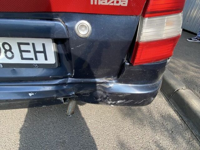 Синій Мазда Деміо, об'ємом двигуна 1.3 л та пробігом 112 тис. км за 700 $, фото 5 на Automoto.ua