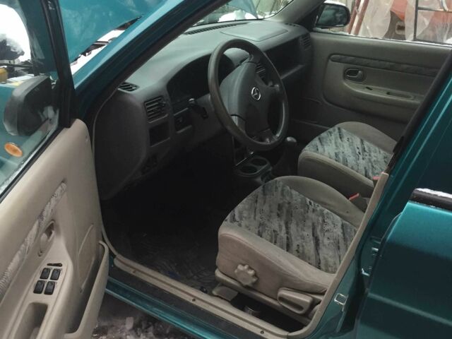 Зеленый Мазда Демио, объемом двигателя 1.3 л и пробегом 180 тыс. км за 1000 $, фото 7 на Automoto.ua