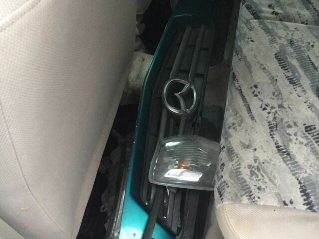 Зеленый Мазда Демио, объемом двигателя 1.3 л и пробегом 180 тыс. км за 1000 $, фото 10 на Automoto.ua