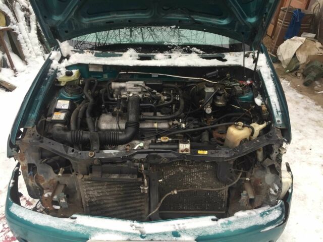 Зеленый Мазда Демио, объемом двигателя 1.3 л и пробегом 180 тыс. км за 1000 $, фото 2 на Automoto.ua