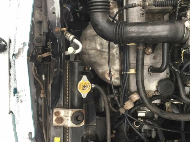 Зеленый Мазда Демио, объемом двигателя 1.3 л и пробегом 180 тыс. км за 1000 $, фото 3 на Automoto.ua