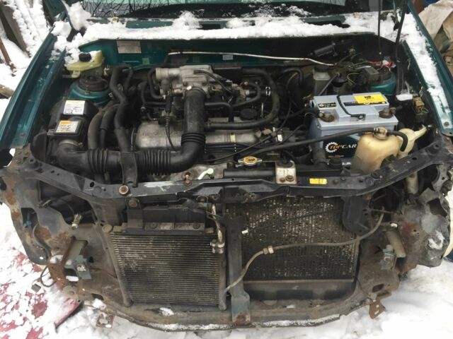 Зеленый Мазда Демио, объемом двигателя 1.3 л и пробегом 180 тыс. км за 1000 $, фото 5 на Automoto.ua