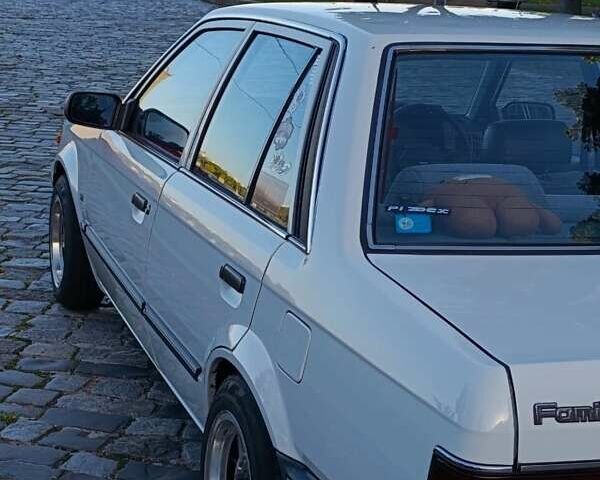 Белый Мазда Фамилия, объемом двигателя 1.5 л и пробегом 136 тыс. км за 5500 $, фото 6 на Automoto.ua