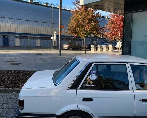 Белый Мазда Фамилия, объемом двигателя 1.5 л и пробегом 136 тыс. км за 5500 $, фото 24 на Automoto.ua