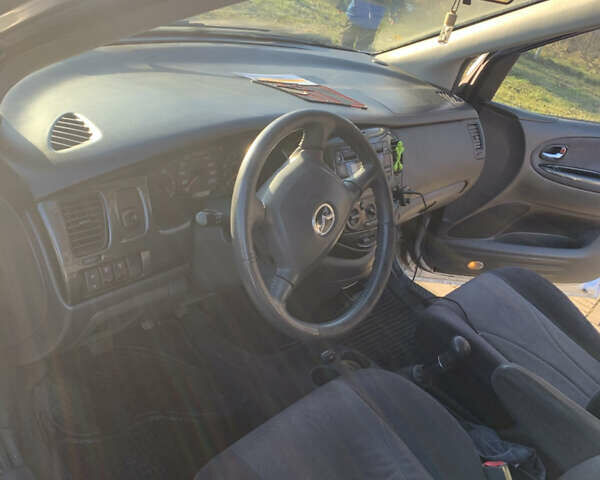 Сірий Мазда МПВ, об'ємом двигуна 2 л та пробігом 248 тис. км за 5300 $, фото 7 на Automoto.ua