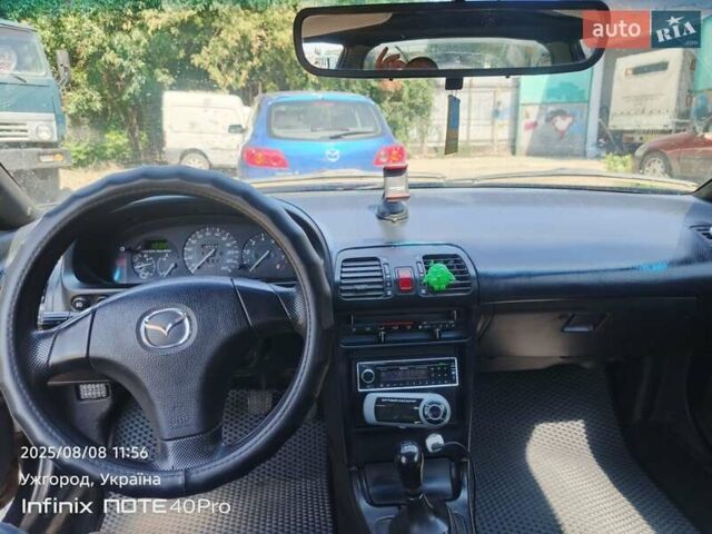 Чорний Мазда МХ-3, об'ємом двигуна 1.6 л та пробігом 196 тис. км за 3000 $, фото 6 на Automoto.ua