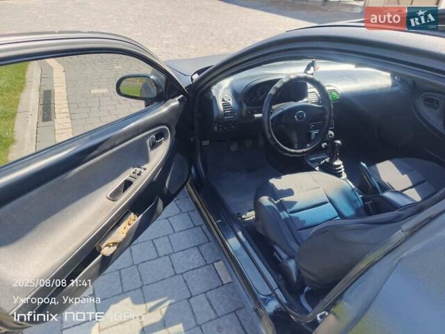 Чорний Мазда МХ-3, об'ємом двигуна 1.6 л та пробігом 196 тис. км за 3000 $, фото 3 на Automoto.ua