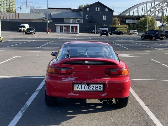 Красный Мазда МХ-3, объемом двигателя 1.6 л и пробегом 257 тыс. км за 1600 $, фото 1 на Automoto.ua