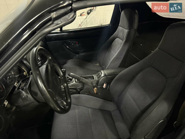 Черный Мазда МХ-5, объемом двигателя 1.6 л и пробегом 129 тыс. км за 12000 $, фото 2 на Automoto.ua