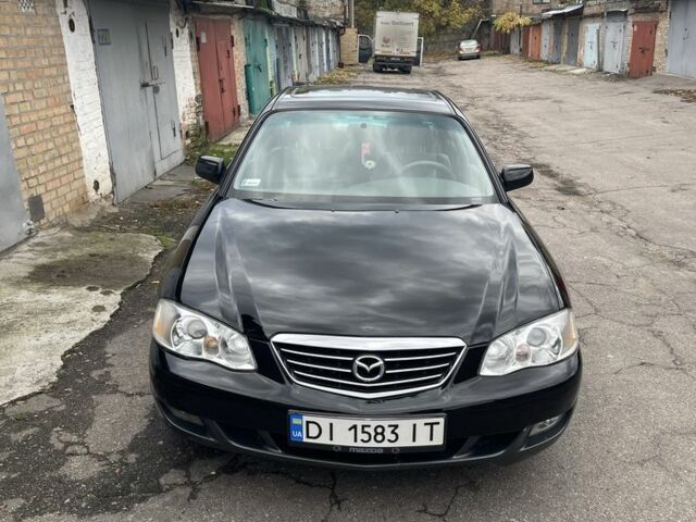Черный Мазда Милления, объемом двигателя 2.5 л и пробегом 247 тыс. км за 4300 $, фото 1 на Automoto.ua