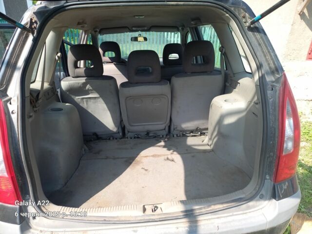 Черный Мазда Премаси, объемом двигателя 2 л и пробегом 300 тыс. км за 800 $, фото 2 на Automoto.ua