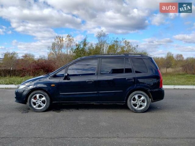 Черный Мазда Премаси, объемом двигателя 2 л и пробегом 250 тыс. км за 2850 $, фото 1 на Automoto.ua