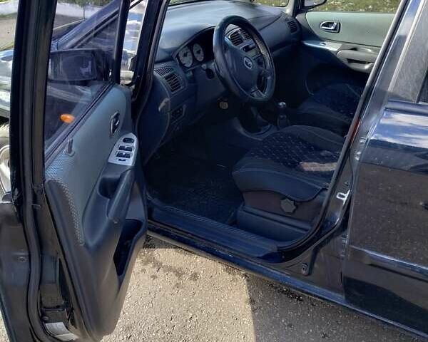 Черный Мазда Премаси, объемом двигателя 2 л и пробегом 250 тыс. км за 2850 $, фото 4 на Automoto.ua