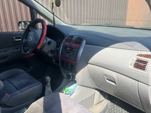 Мазда Премаси 1999 в Кицмане на Automoto.ua Красный Мазда Премаси, объемом двигателя 2 л и пробегом 348 тыс. км за 2700 $, фото 5 на Automoto.ua