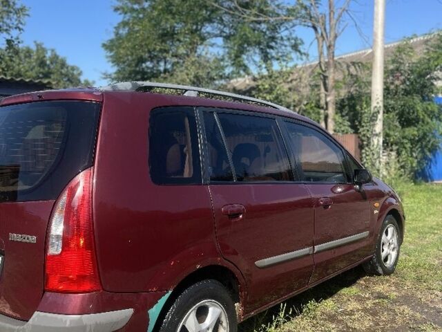 Мазда Премаси 1999 в Кицмане на Automoto.ua Красный Мазда Премаси, объемом двигателя 2 л и пробегом 348 тыс. км за 2700 $, фото 2 на Automoto.ua