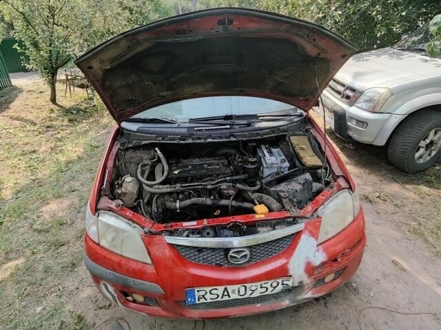 Красный Мазда Премаси, объемом двигателя 2 л и пробегом 100 тыс. км за 725 $, фото 2 на Automoto.ua