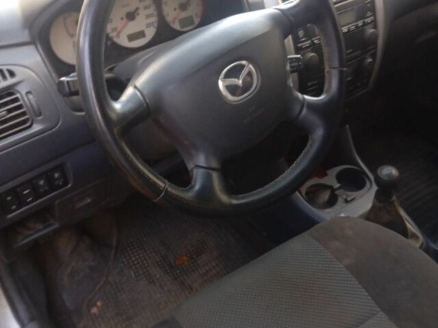 Серый Мазда Премаси, объемом двигателя 1.8 л и пробегом 120 тыс. км за 2000 $, фото 4 на Automoto.ua