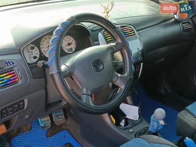 Синій Мазда Премасі, об'ємом двигуна 1.8 л та пробігом 245 тис. км за 4240 $, фото 12 на Automoto.ua