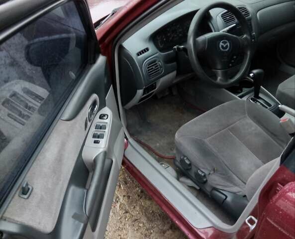 Красный Мазда Протеж, объемом двигателя 1.99 л и пробегом 200 тыс. км за 1500 $, фото 2 на Automoto.ua