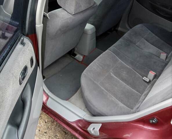 Красный Мазда Протеж, объемом двигателя 1.99 л и пробегом 200 тыс. км за 1500 $, фото 5 на Automoto.ua