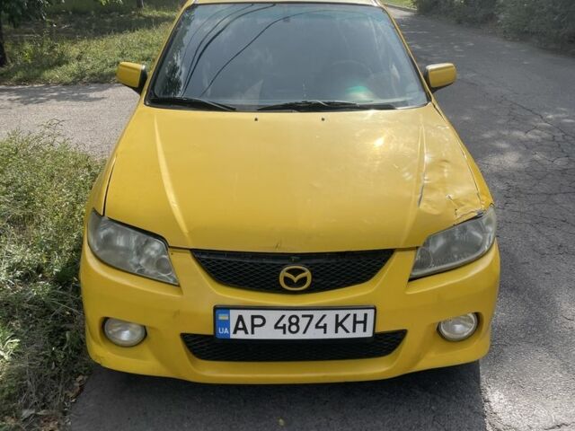 Желтый Мазда Протеж, объемом двигателя 2 л и пробегом 210 тыс. км за 3000 $, фото 6 на Automoto.ua
