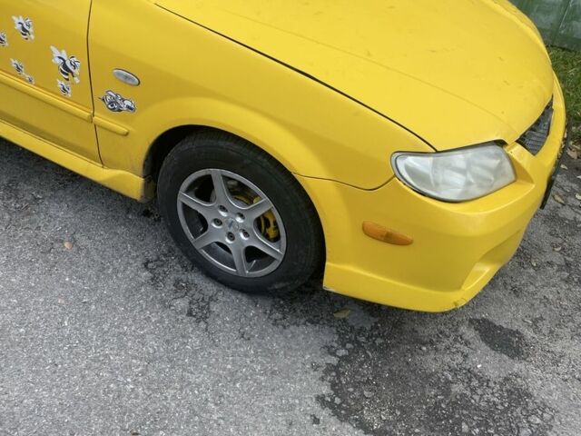 Желтый Мазда Протеж, объемом двигателя 2 л и пробегом 210 тыс. км за 3000 $, фото 5 на Automoto.ua