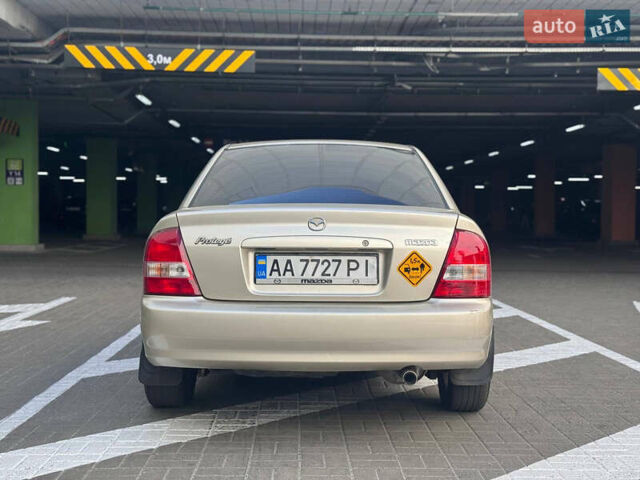 Серый Мазда Протеж, объемом двигателя 2 л и пробегом 85 тыс. км за 3600 $, фото 7 на Automoto.ua