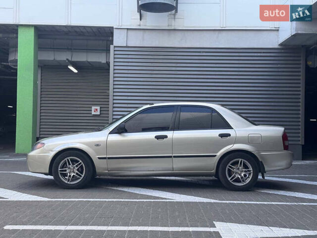 Серый Мазда Протеж, объемом двигателя 2 л и пробегом 85 тыс. км за 3600 $, фото 3 на Automoto.ua