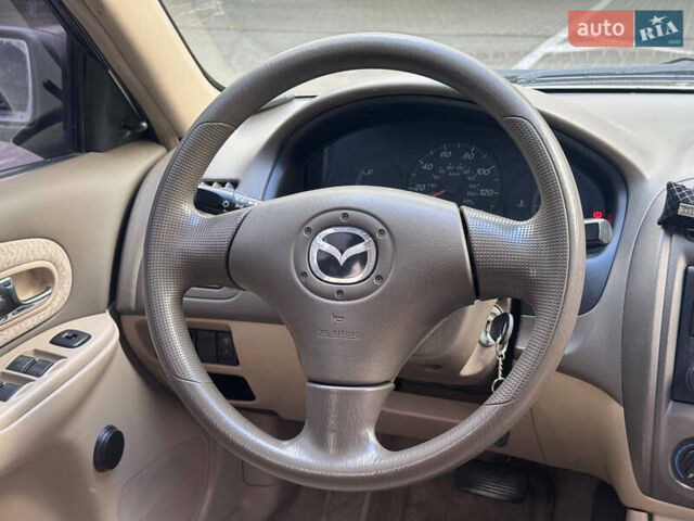 Серый Мазда Протеж, объемом двигателя 2 л и пробегом 85 тыс. км за 3600 $, фото 14 на Automoto.ua