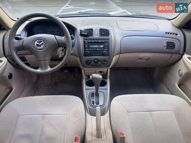 Серый Мазда Протеж, объемом двигателя 2 л и пробегом 85 тыс. км за 3600 $, фото 11 на Automoto.ua