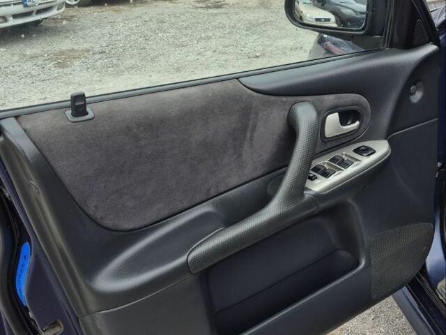 Синій Мазда Протеже, об'ємом двигуна 2 л та пробігом 180 тис. км за 3500 $, фото 7 на Automoto.ua