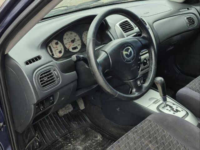 Синій Мазда Протеже, об'ємом двигуна 2 л та пробігом 180 тис. км за 3500 $, фото 14 на Automoto.ua