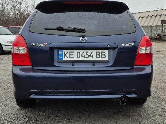Синій Мазда Протеже, об'ємом двигуна 2 л та пробігом 180 тис. км за 3500 $, фото 4 на Automoto.ua
