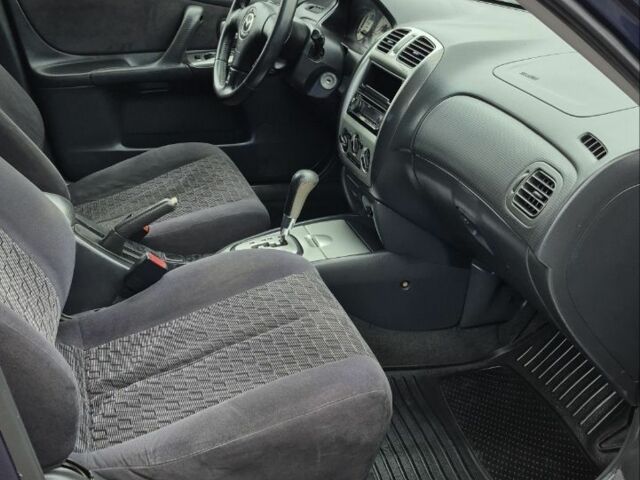 Синій Мазда Протеже, об'ємом двигуна 2 л та пробігом 180 тис. км за 3500 $, фото 10 на Automoto.ua