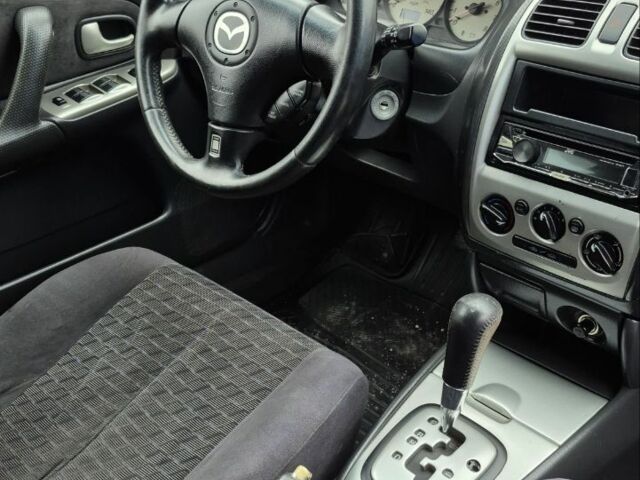 Синій Мазда Протеже, об'ємом двигуна 2 л та пробігом 180 тис. км за 3500 $, фото 11 на Automoto.ua