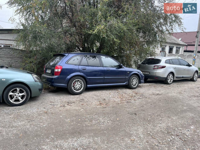 Синій Мазда Протеже, об'ємом двигуна 2 л та пробігом 299 тис. км за 3500 $, фото 7 на Automoto.ua