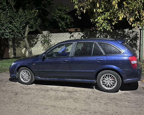 Синій Мазда Протеже, об'ємом двигуна 2 л та пробігом 299 тис. км за 3500 $, фото 6 на Automoto.ua