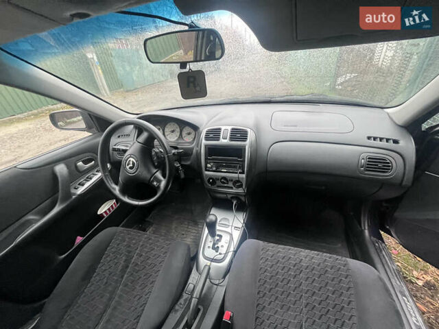 Синій Мазда Протеже, об'ємом двигуна 2 л та пробігом 299 тис. км за 3500 $, фото 10 на Automoto.ua