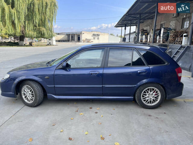 Синій Мазда Протеже, об'ємом двигуна 2 л та пробігом 299 тис. км за 3500 $, фото 5 на Automoto.ua