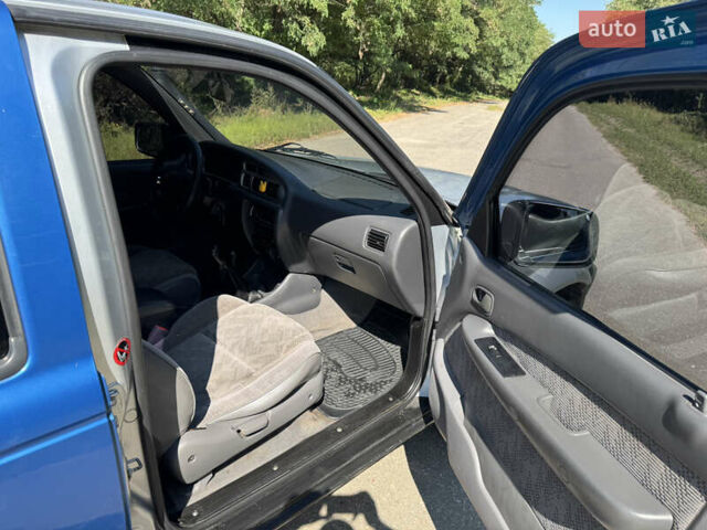 Белый Мазда Трибьют, объемом двигателя 2.5 л и пробегом 387 тыс. км за 4750 $, фото 10 на Automoto.ua