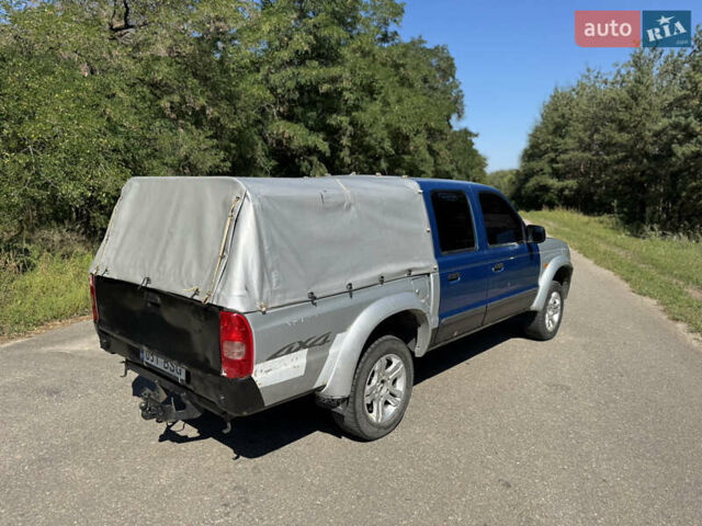 Белый Мазда Трибьют, объемом двигателя 2.5 л и пробегом 387 тыс. км за 4750 $, фото 4 на Automoto.ua