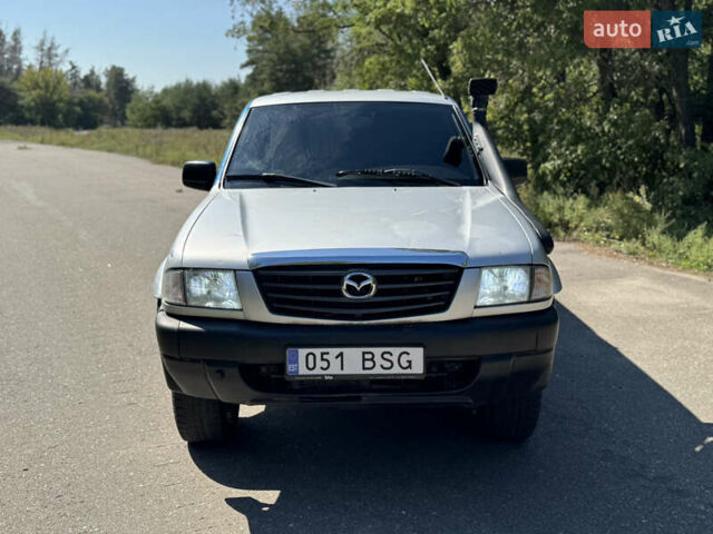 Белый Мазда Трибьют, объемом двигателя 2.5 л и пробегом 387 тыс. км за 4750 $, фото 7 на Automoto.ua