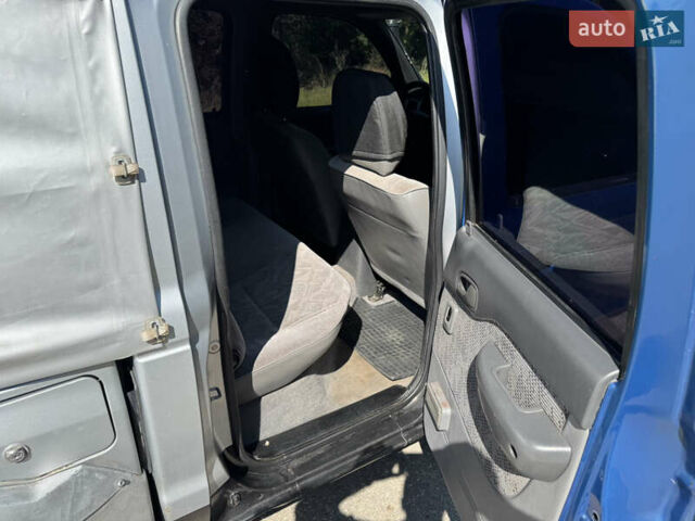 Белый Мазда Трибьют, объемом двигателя 2.5 л и пробегом 387 тыс. км за 4750 $, фото 11 на Automoto.ua