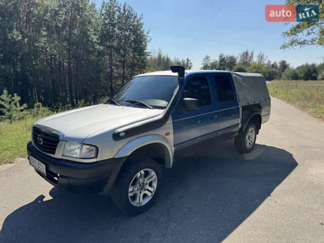 Белый Мазда Трибьют, объемом двигателя 2.5 л и пробегом 387 тыс. км за 4750 $, фото 2 на Automoto.ua