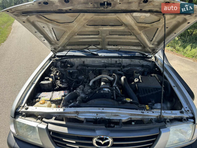 Белый Мазда Трибьют, объемом двигателя 2.5 л и пробегом 387 тыс. км за 4750 $, фото 16 на Automoto.ua